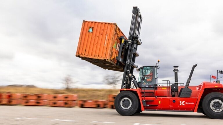 Bawarith forklift lifting a shipping container